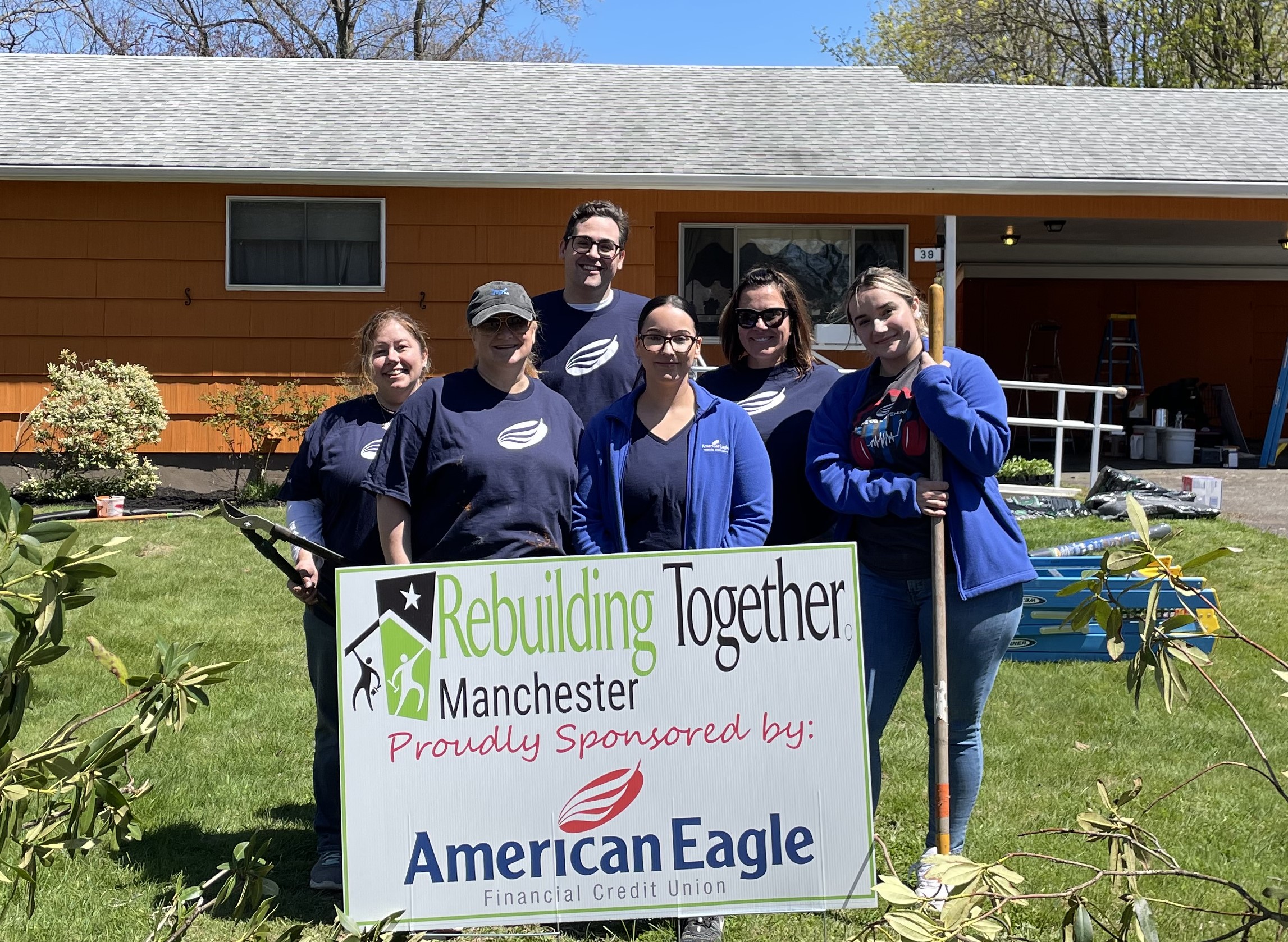AEFCU Group with Sign